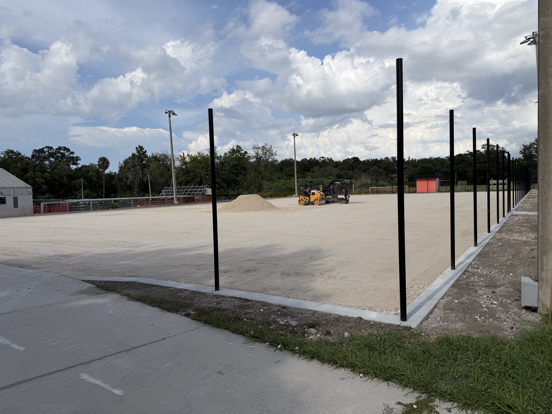 Prepared sport court base with perimeter posts